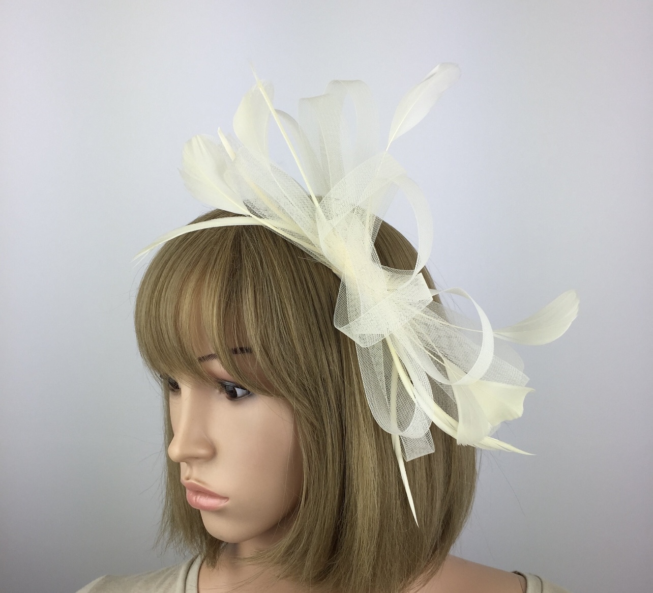 Ivory Cream Bow Fascinator with Loops and Feathers